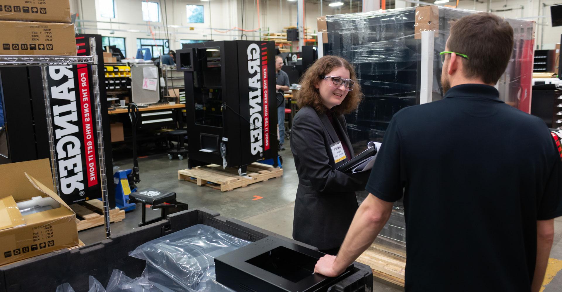 An Agnes Scott Summit student talks with an employee at her internship site.